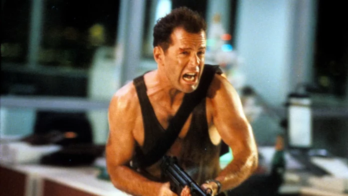 Photo from Die Hard (1988), directed by John McTiernan and starring Bruce Willis, Alan Rickman, and Alexander Godunov, produced by Twentieth Century Fox.