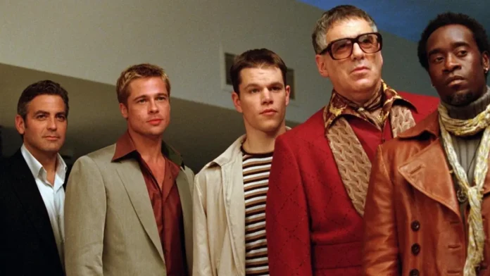 Scene from Ocean's Eleven (2001) by Warner Bros., featuring Danny Ocean and his crew strategizing a complex heist in a stylish Las Vegas setting. Source: Filmdb.co.uk