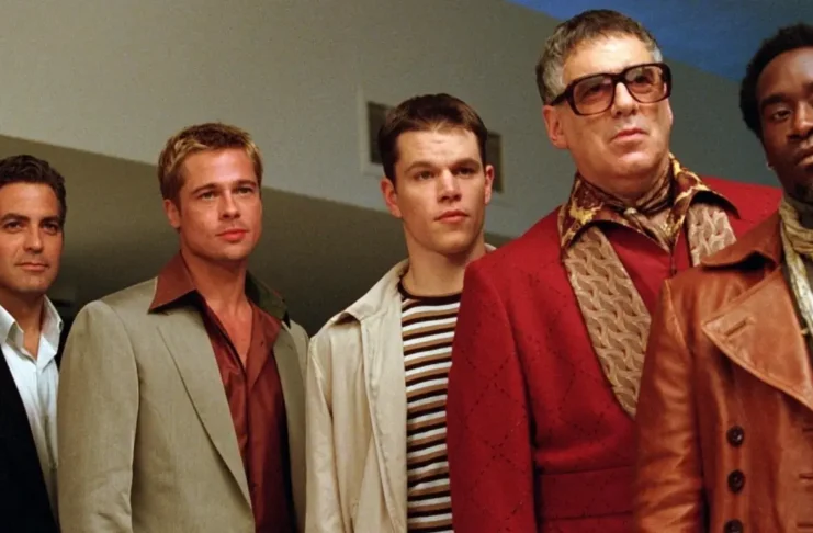 Scene from Ocean's Eleven (2001) by Warner Bros., featuring Danny Ocean and his crew strategizing a complex heist in a stylish Las Vegas setting. Source: Filmdb.co.uk