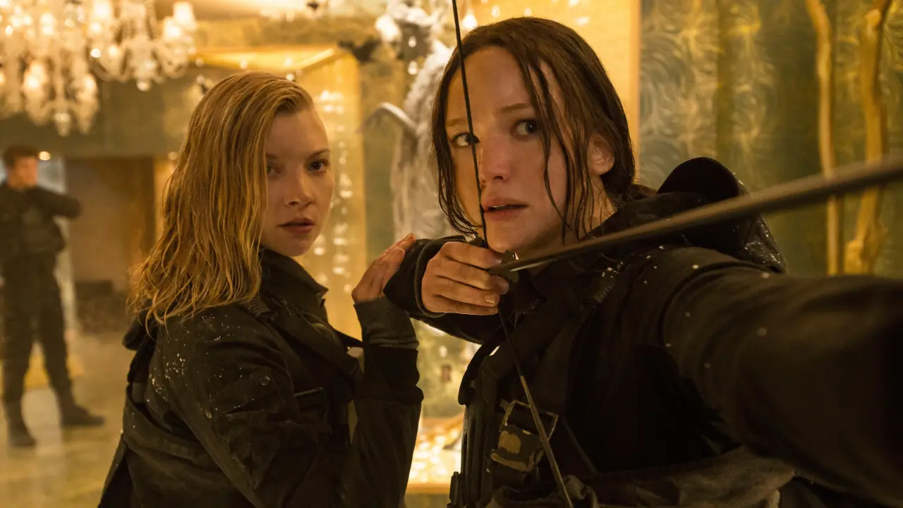 Scene from The Hunger Games: Mockingjay - Part 2 (2015) by Lionsgate Films, featuring Katniss Everdeen leading the rebellion in a tense and dramatic moment. Source: Filmdb.co.uk