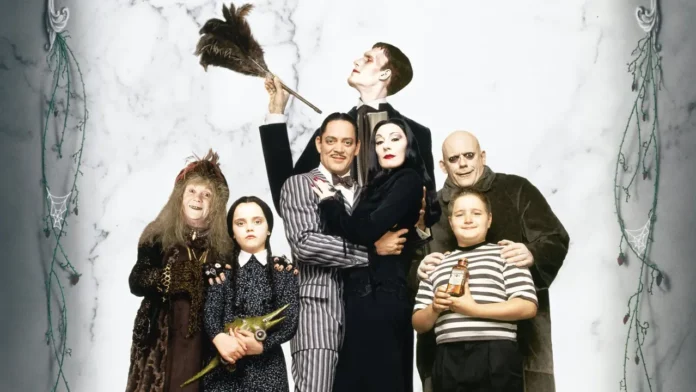 Photo from Addams Family (1991) starring Christina Ricci, Anjelica Huston, Raúl Juliá, and Christopher Lloyd, produced by Paramount Pictures.